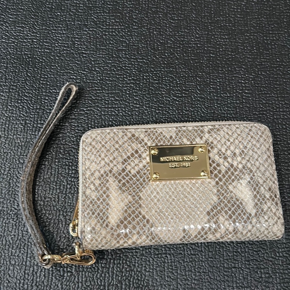 Snake skin print Michael kors wristlet. Like new condition.